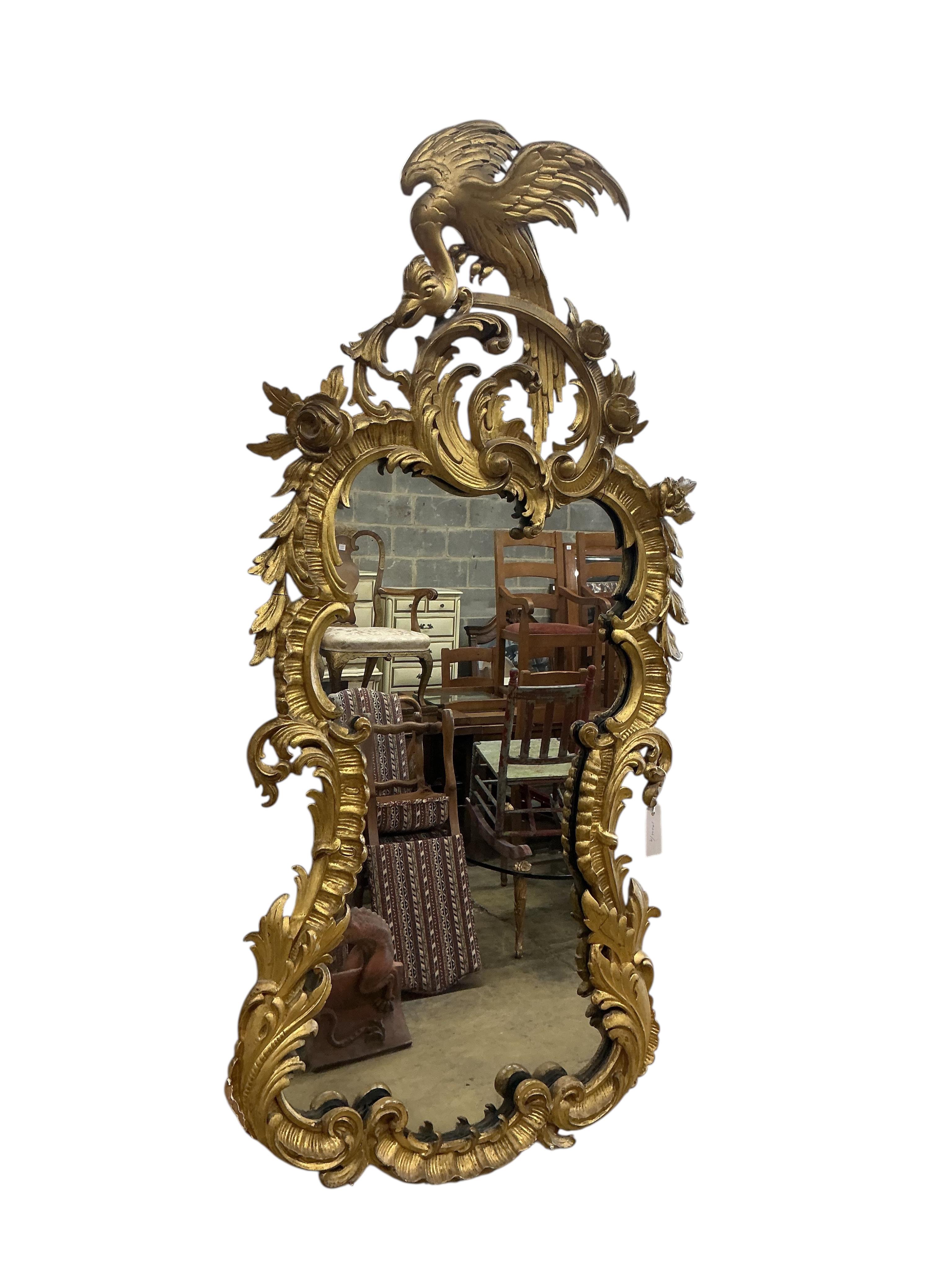 An 18th century style carved giltwood wall mirror, width 64cm, height 128cm